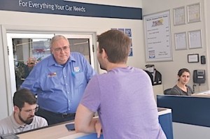 Chuck stops to talk with a customer. 