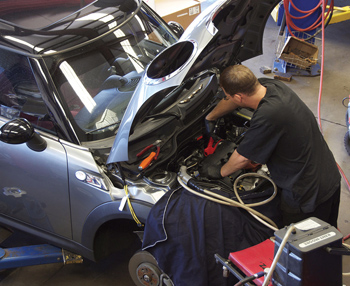 technician jeffery haremza is working on a customer’s car.