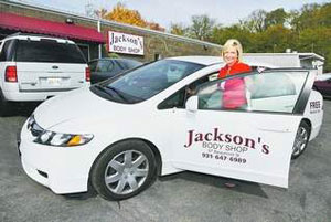 Suzy Hopkins departs in a vehicle they loan to customers as their car is being looked over at Jackson's Body Shop. (GREG WILLIAMSON/THE LEAF-CHRONICLE)